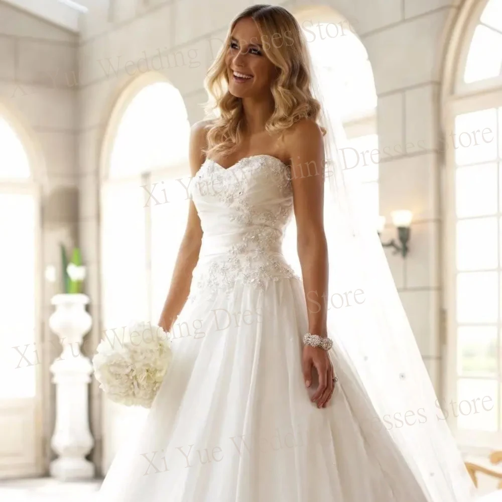 Sexy Strapless 2025 Wedding Dresses Backless Strapless Satin Customized Gowns Princess Sleeveless Backless Appliques Brush Train