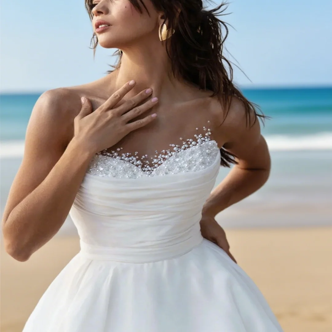 

Customized white strapless pearl A-line wedding dress. Simple and sweet wedding formal dress for a ceremony.