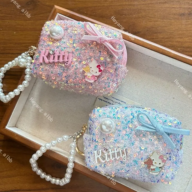 KT exquisiter kleiner Duftbeutel-Anhänger, kreative Mode-Münzbörse, Kopfhörertasche, niedliches Mädchen-Accessoire, tragbar und vielseitig.