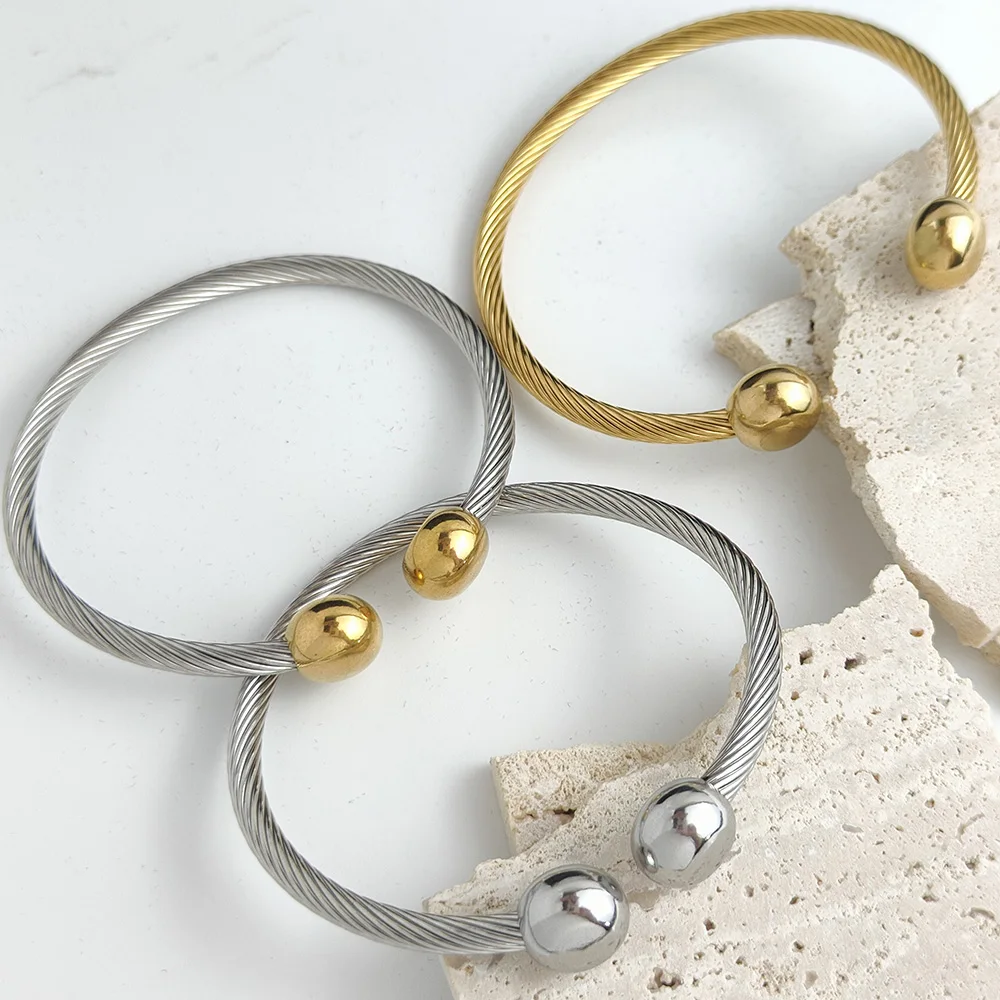 Double ball gold-plated stainless steel bracelet, twisted steel wire C-shaped design, classic fashion jewelry