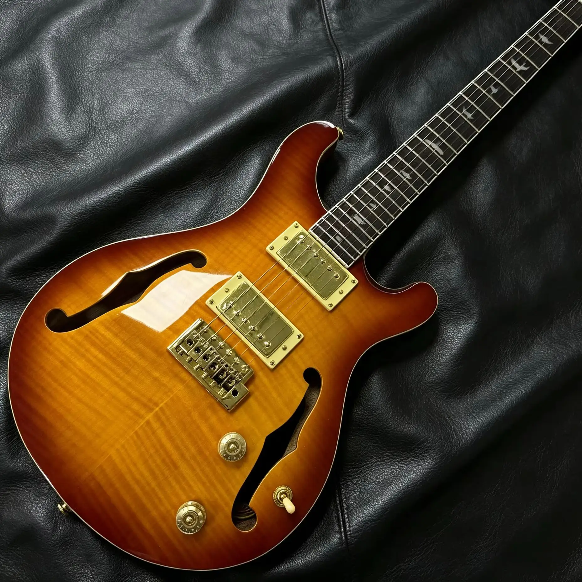 Half Hollow Electric Guitar, F‑Shaped Design, Tiger Pattern, Maple Veneer, Sunset Gradient Finish, High‑Gloss Finish, Ebony Fretboard, Gold Hardware, 6‑String With 24 Frets, Bird‑Shaped Inlay Marker, Dual Pickups.