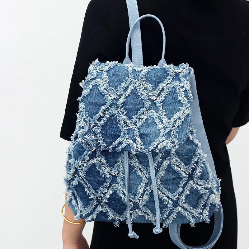 Hot selling denim backpack large capacity women\'s quilted diamond checkered flip backpack raw edge tassel denim bag