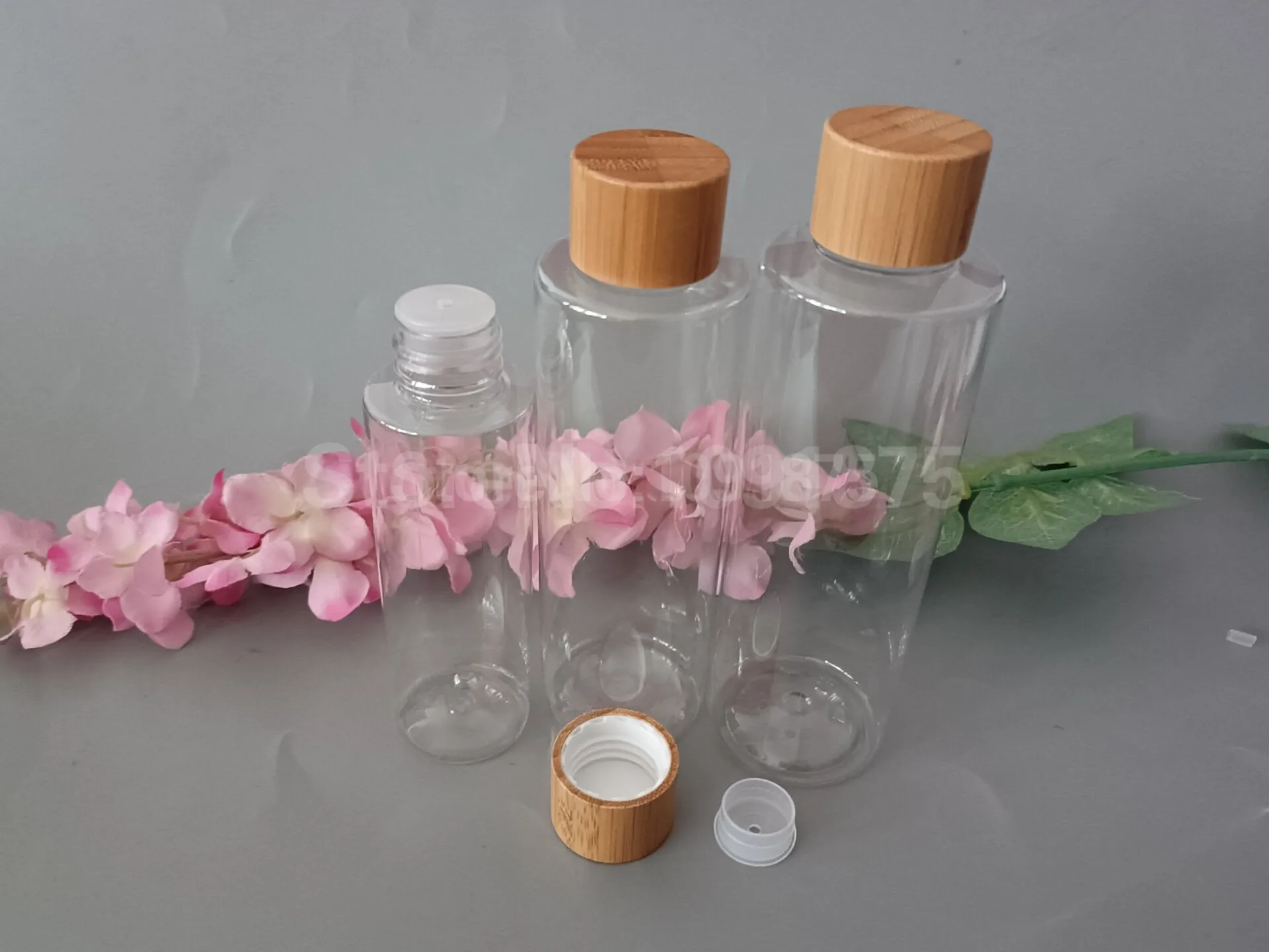 

10pcs 100ml 200ml 250ml 500ml Clear Liquid Toner Plastic Bottles With Bamboo Screw Cap Transparent PET Cosmetic Bottles