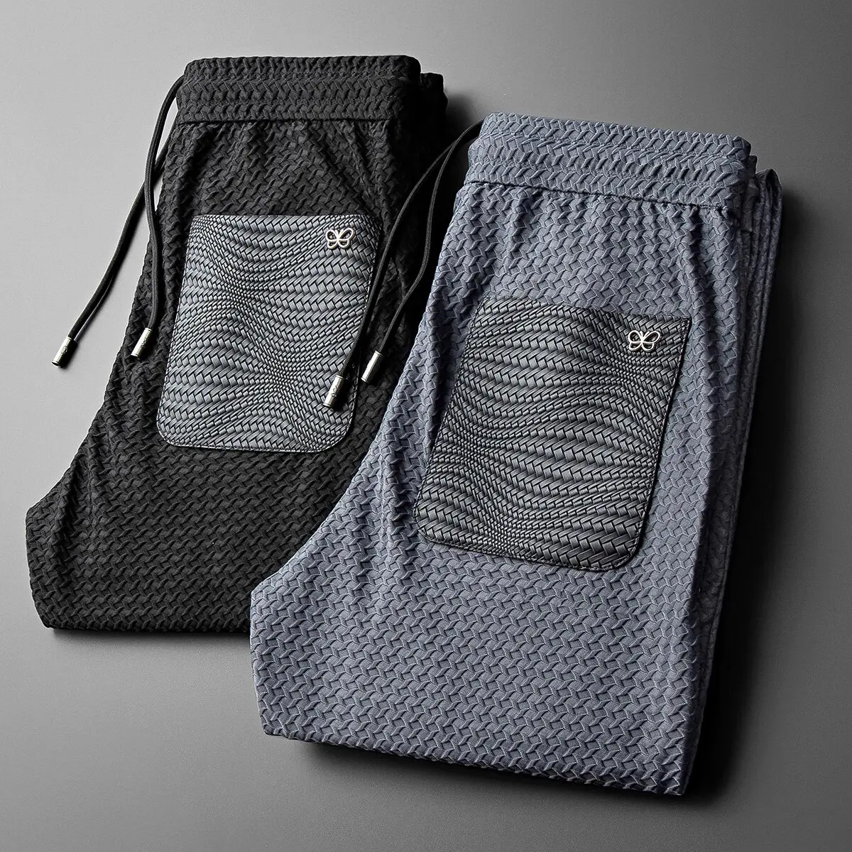 

High-end elastic ice silk checkered sweatpants for men in summer, tight-fitting small feet, elastic drawstring, ice-like sports
