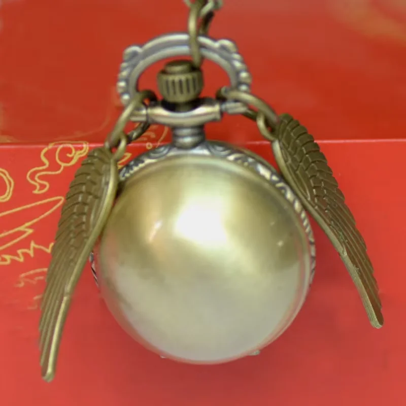 

7001Small quartz pocket watch Innovative design small bronze light ball with wings quartz pocket watch