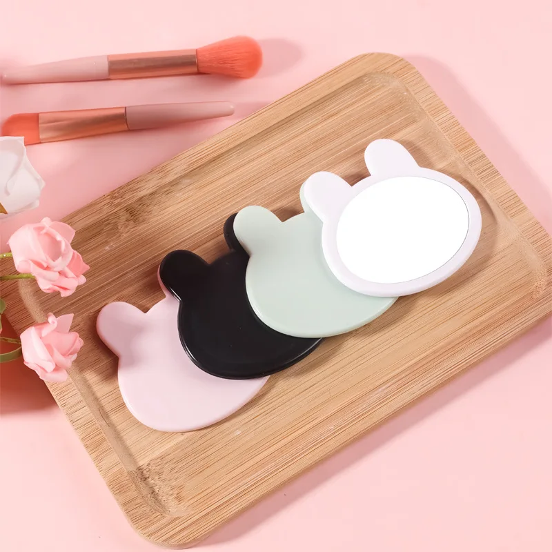 مرآة مكياج على شكل رأس أرنب مبتكرة لطيفة صغيرة محمولة باللون الوردي والأخضر والأبيض والأسود