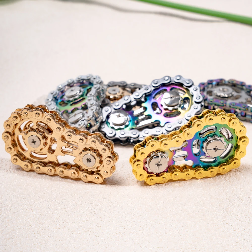 1 لعبة دوارة متململة على شكل سلسلة دراجات معدنية ملونة، فعالة في تخفيف التوتر