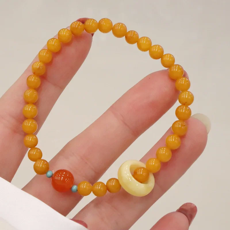 

Free shipping Beeswax hand string female oil yellow old honey south red agate bracelet jewelry charm gift boho designer manual