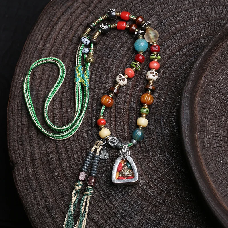 Tibetan-style medicinal Buddha Gahu box pendant sweater chain, vintage bone and glass accessories, woven rope necklace
