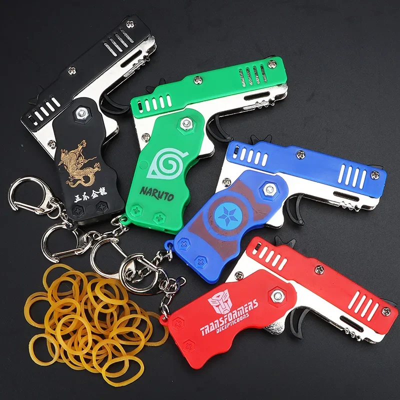 1pcs Mini Metal Gun Folding Rubber Band Toy Outdoor Sports Keychain Toy 6 Bursts Rubber Pistol Kids Gifts Party Favor