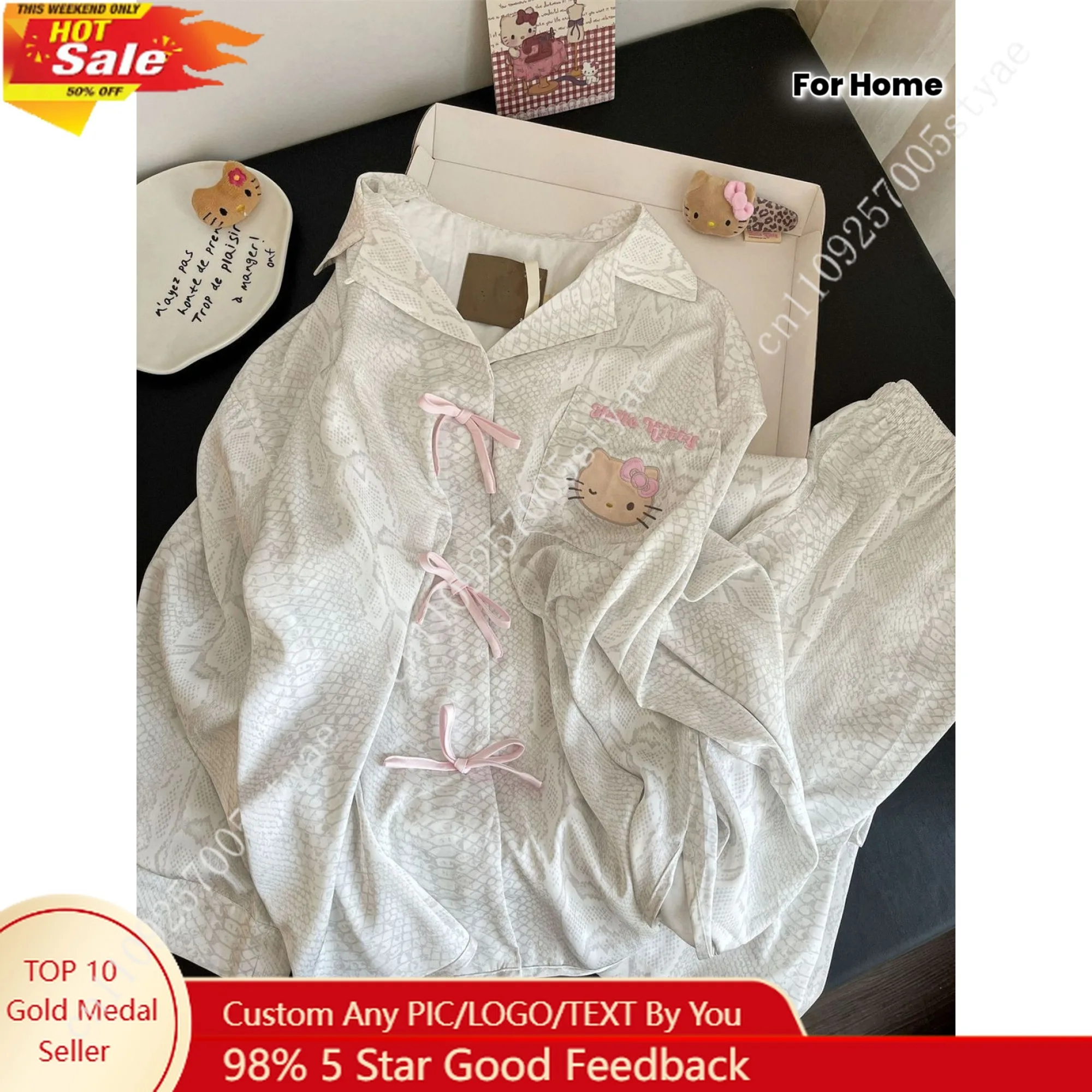 

Hello Kitty Long-Sleeve Pajama Set Featuring A Bow and Button Design Made of Material Includes Long Pants and Long-Sleeve Top