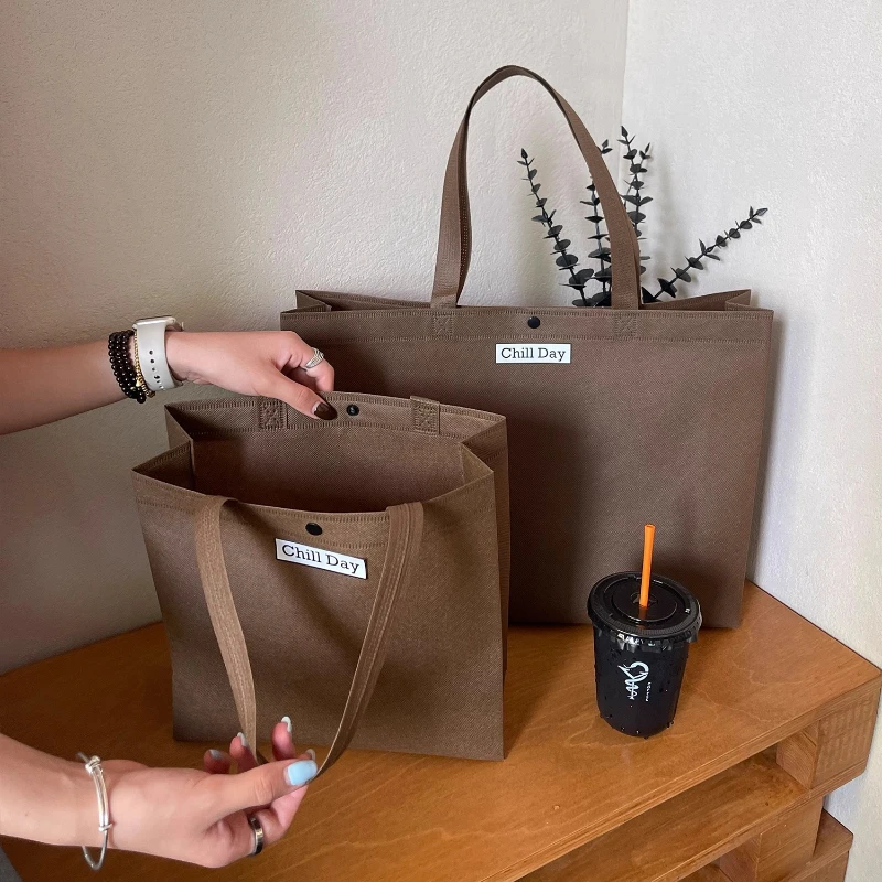 

25pcs New High-grade Non-woven Fabric Handbag Specialized Shopping Packing Bag Clothing Stores Environmentally Friendly Gift Bag