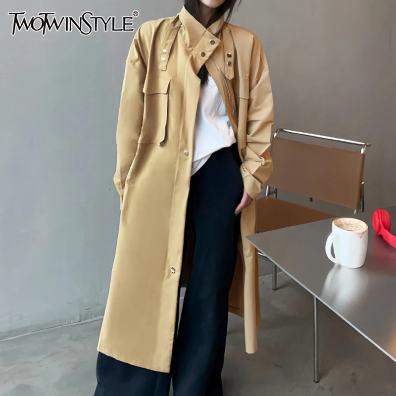 

TWOTWINSTYLE Solid Loose Casual Trench For Women Stand Collar Long Sleeve Patchwork Zipper Minimalist Coats Female Fashion New