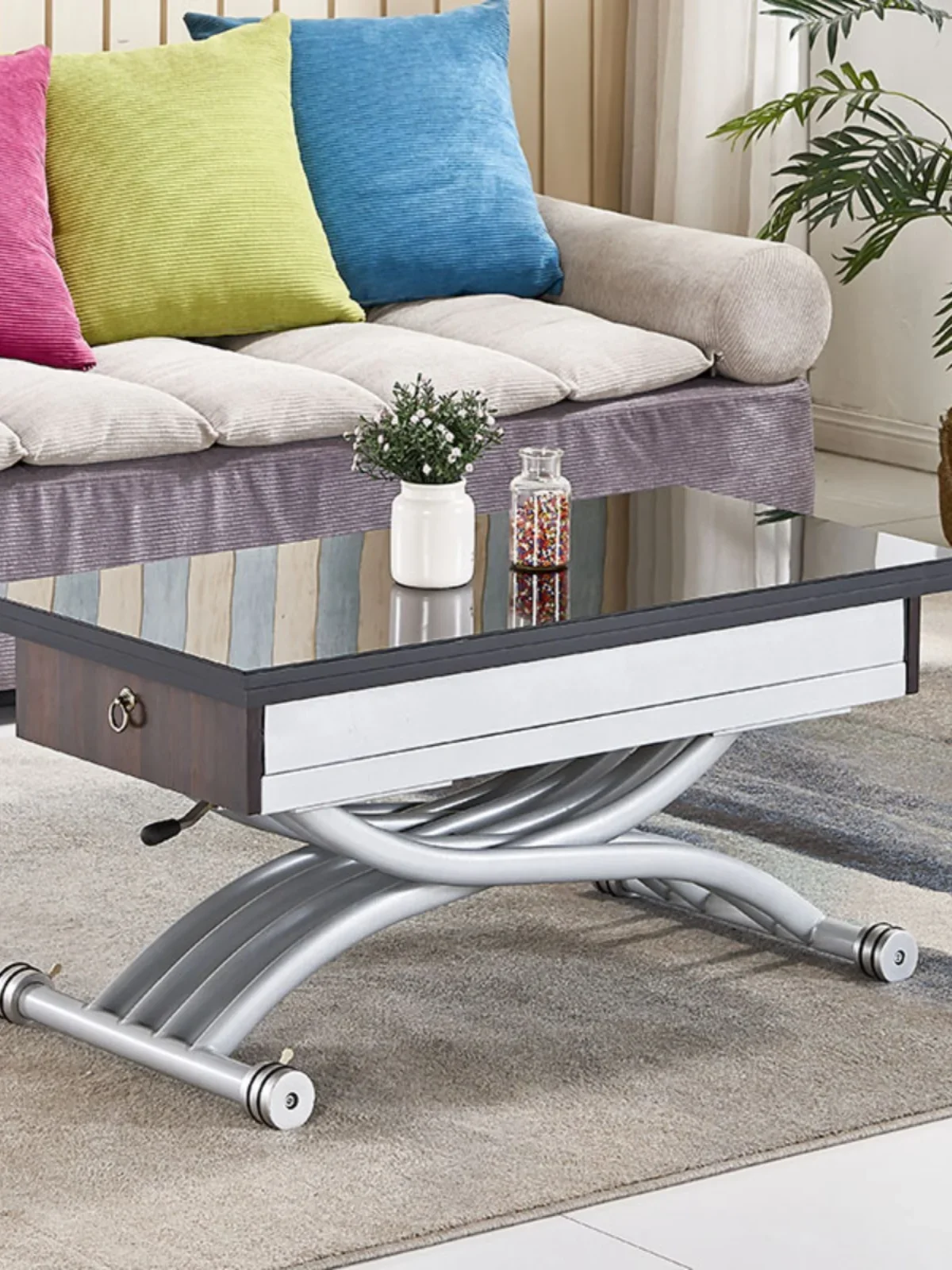 

Space-saving can be lifted and lowered coffee table becomes dining table dual-purpose