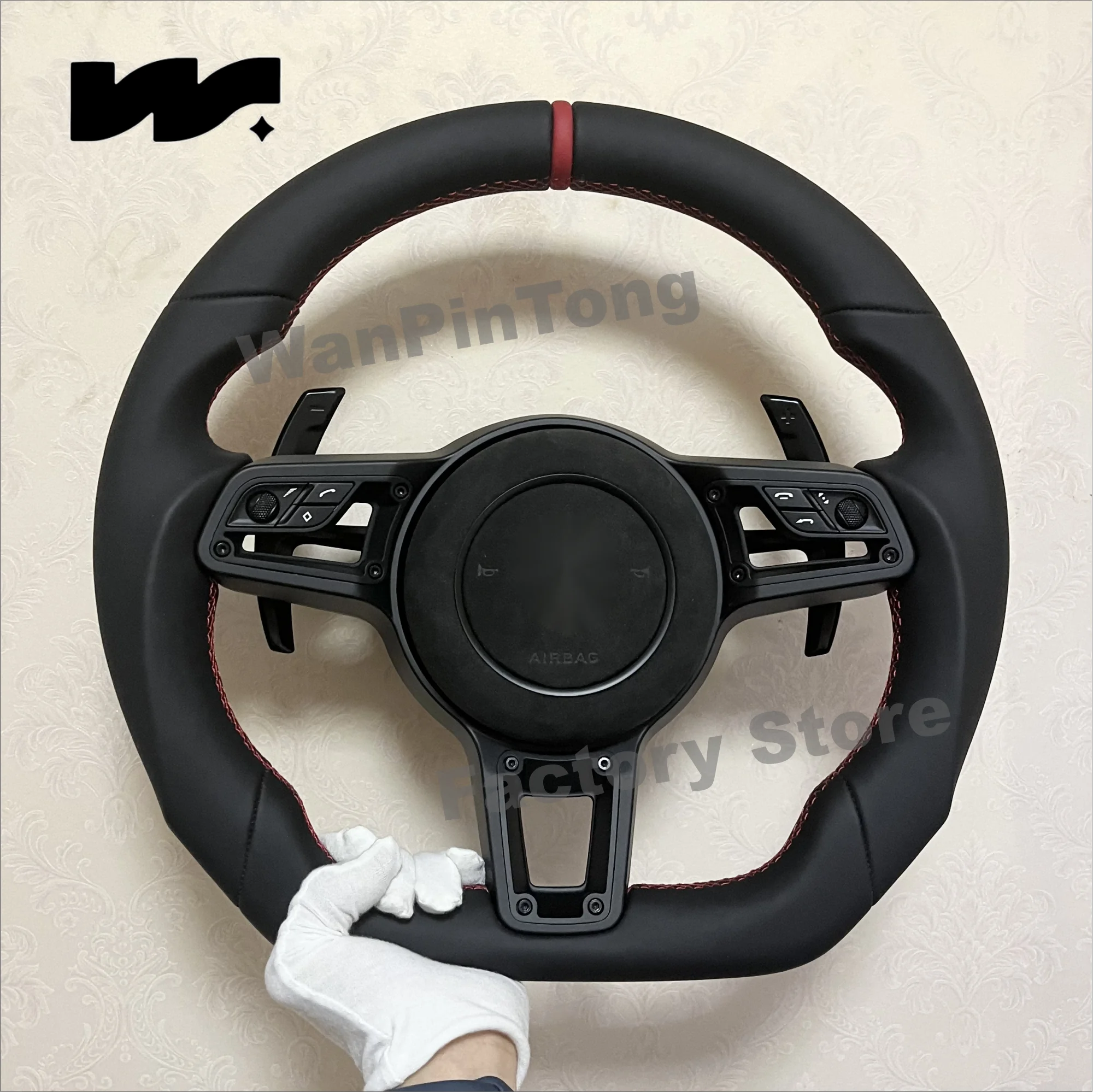 

Customized for Porsche, with red markings on the top and a black leather sports style steering wheel