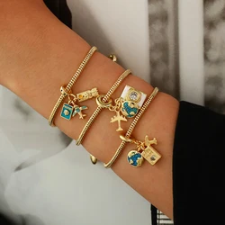 A stylish vintage copper and zirconium Earth Airplane Book pendant bracelet suitable for gift-giving holiday parties