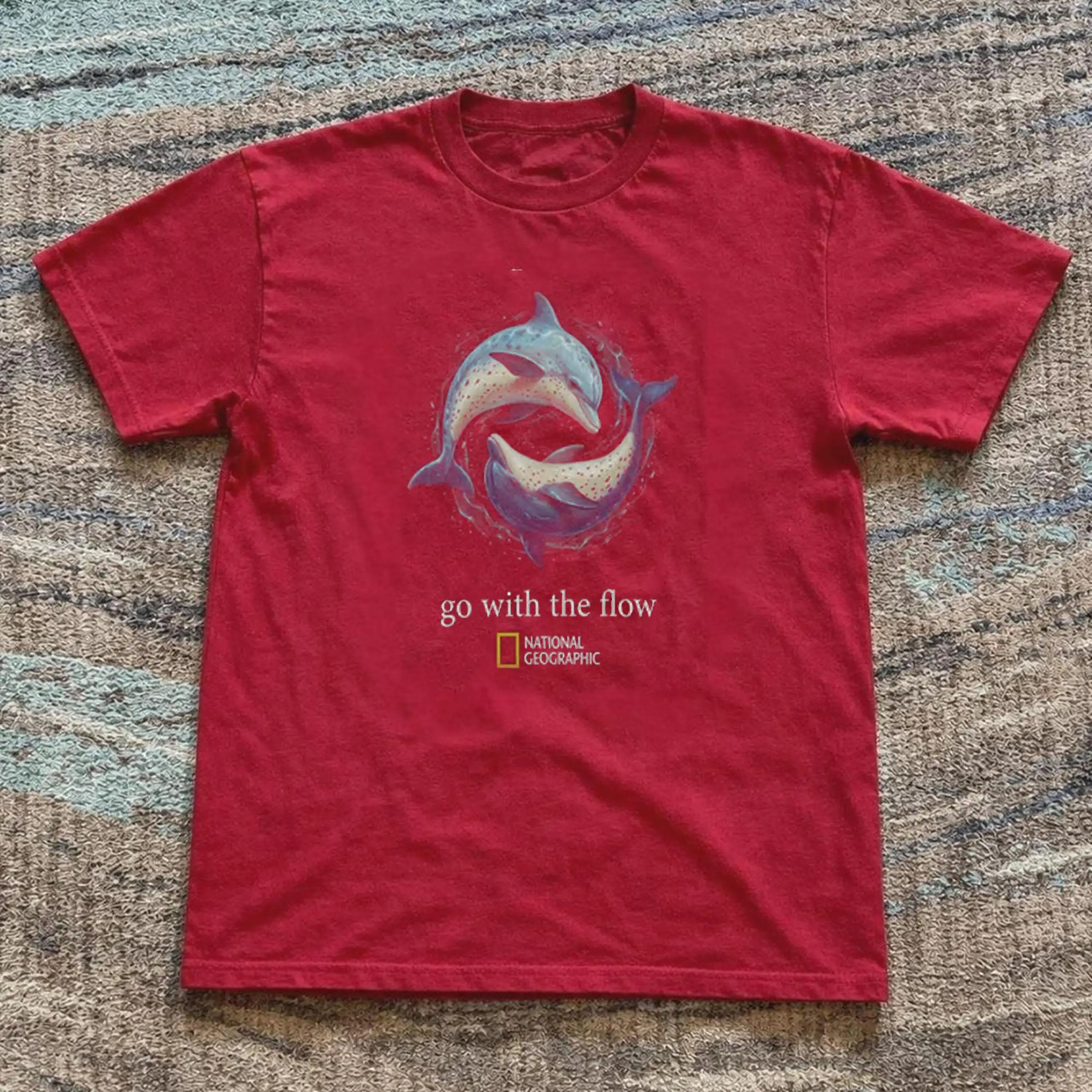 Black National Geographic Short Sleeved T-shirt with Dolphin Pattern and The Words' Go with The Flow 'printed on It