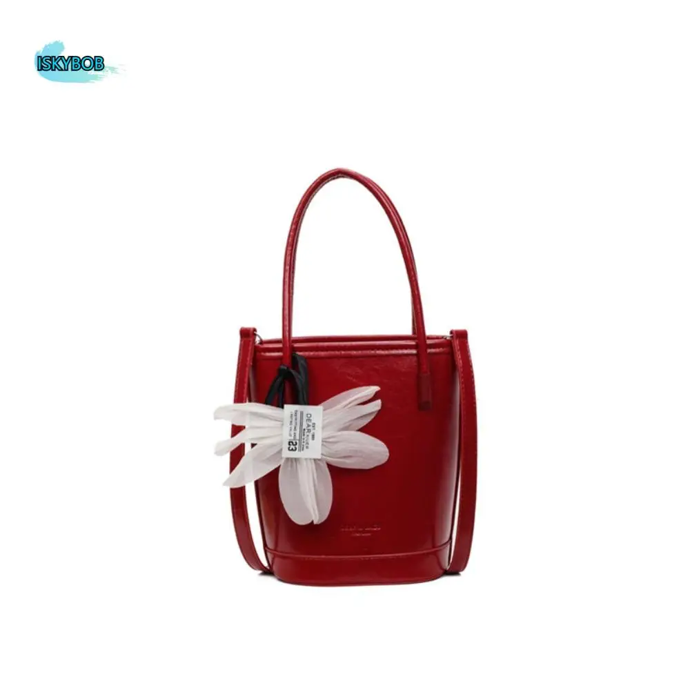Modieuze Pu lederen bloemenemmertas met hanger Grote capaciteit dameshandtas Elegante effen kleur Crossbody tas buiten