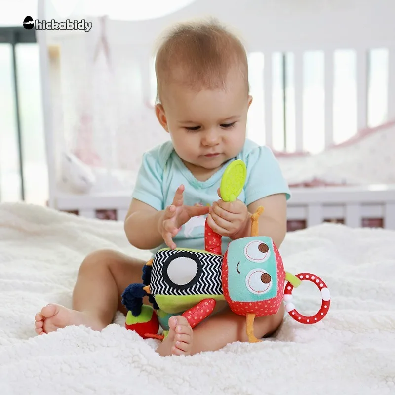 Cama colgante para coche de bebé, muñeco Robot multifuncional con mordedor, juguete pequeño de restricción