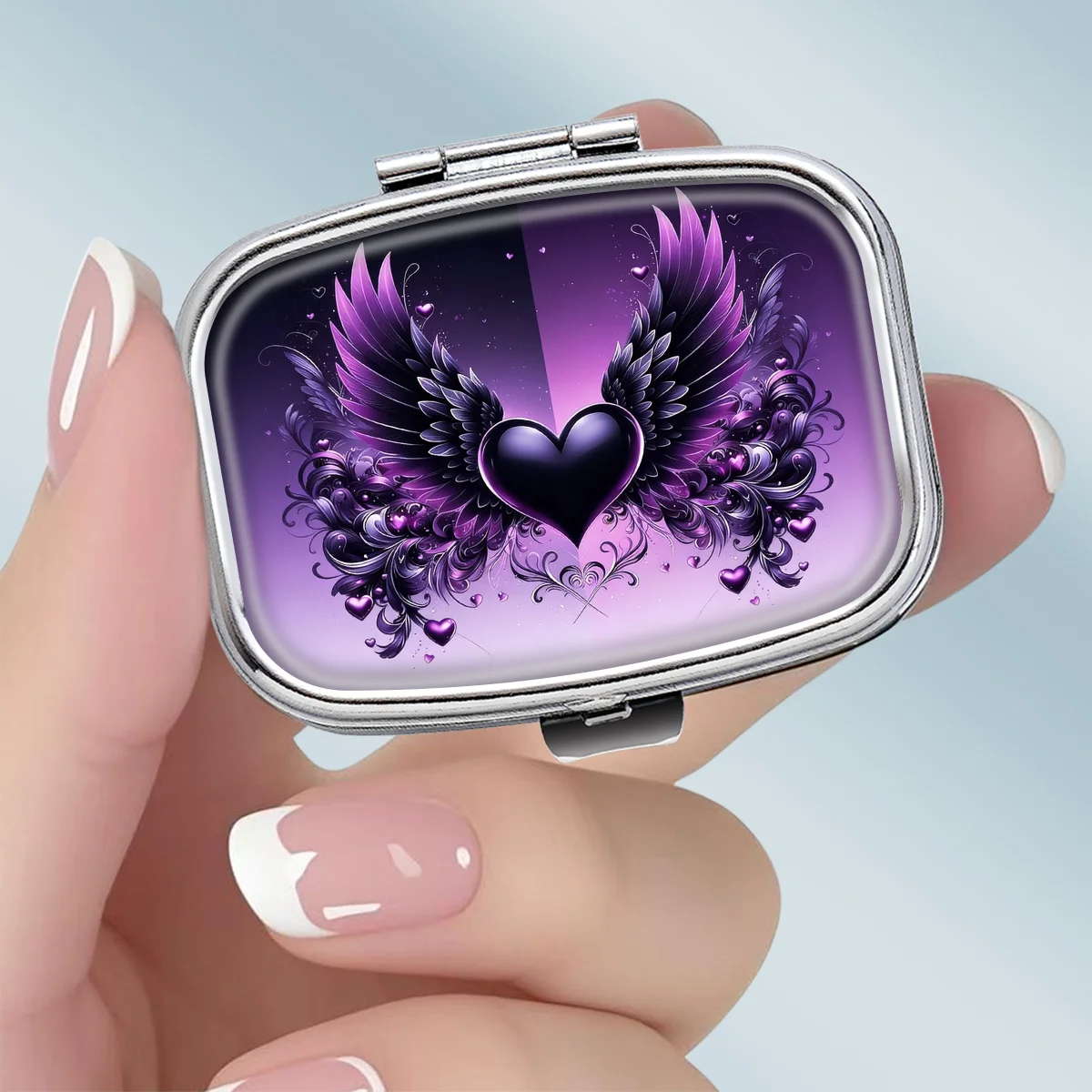 1PC compact 2-compartment square metal pill box, featuring a romantic gothic design with a purple winged heart theme, portable decorative vitamin storage box, or a unique gift for your wallet