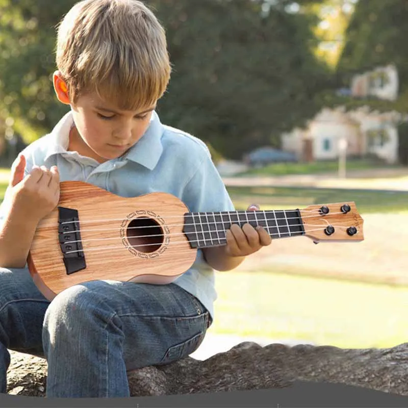 Mini ukelele de simulación de plástico para niños, guitarra pequeña para principiantes, instrumento Musical, juguetes educativos, regalos, 1 piezas