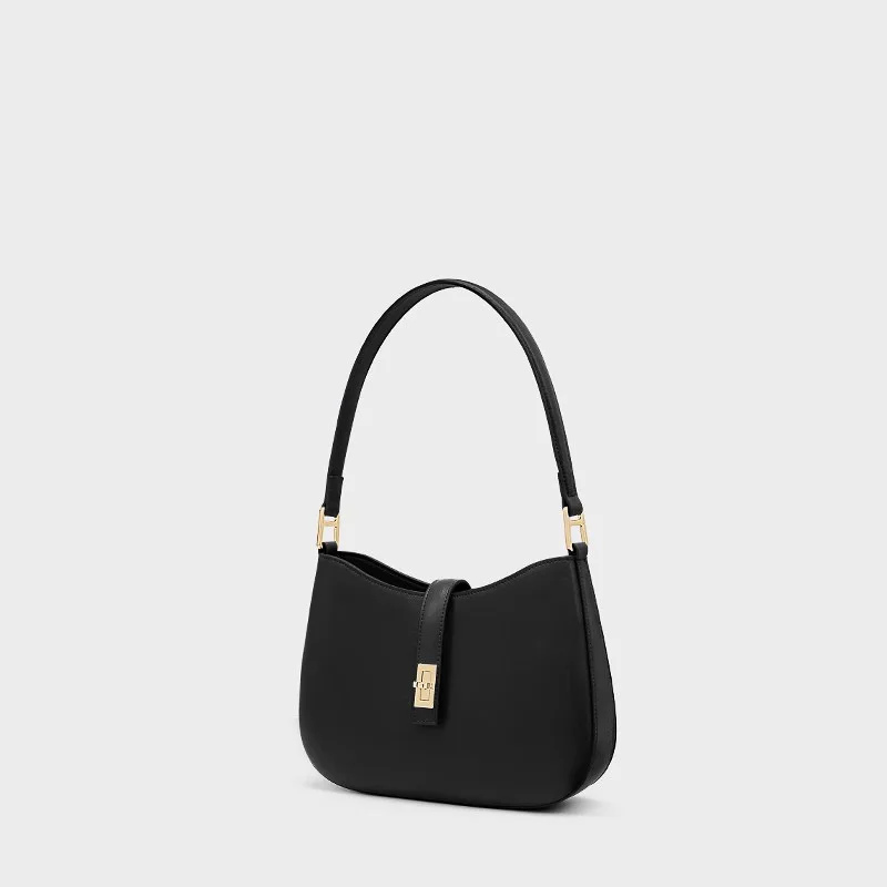 A bolsa da lua crescente. Definido por sua curva chique e couro premium. Um ombro/ponte elegante e versátil.