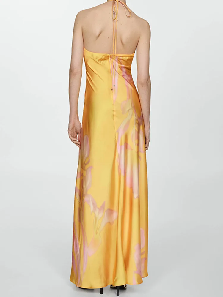 2025年夏新作 イエロー プリント サテンワンピース ノースリーブ ハンギングネック バックレス ロングスカート セクシー スタイル ファッションと快適さを兼ね備えたドレス