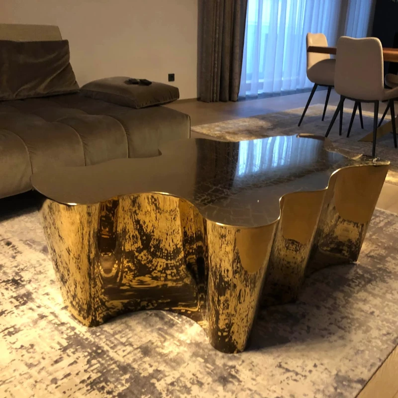 

Luxury and unique central table with etched gold stainless steel trunk coffee table