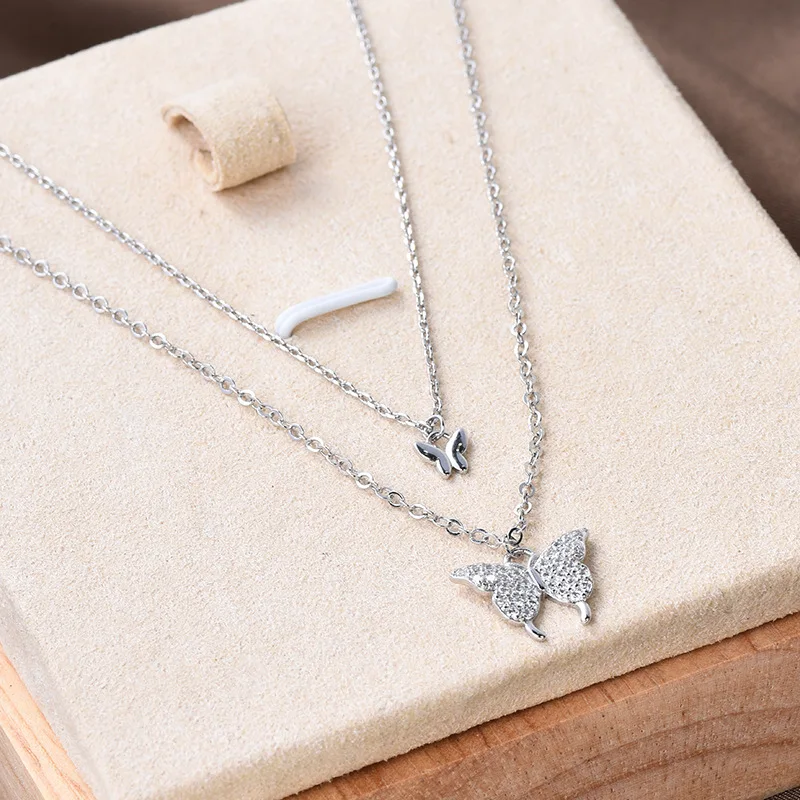 Nuova collana a farfalla da donna a doppio strato in acciaio al titanio, catena con clavicola a farfalla