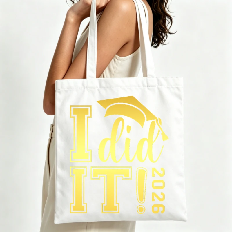 Graduate's letter print canvas tote bag with mortarboard graphic, perfect for graduation celebration and casual daily use