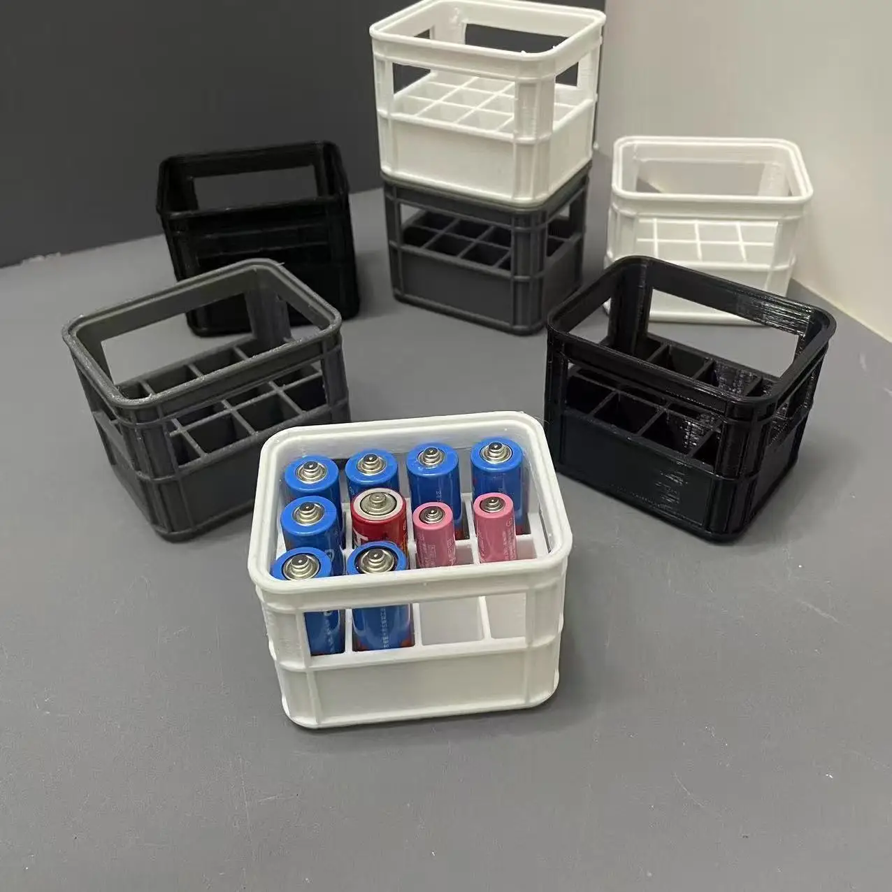 3D printed battery storage box compatible with AA and AAA sizes.