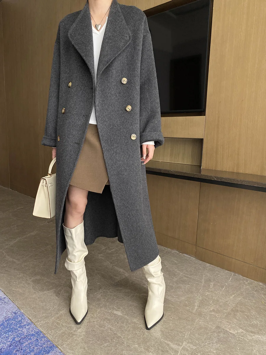 Autumn and winter women's casual solid color stand up collar long sleeved belt decoration loose long coat