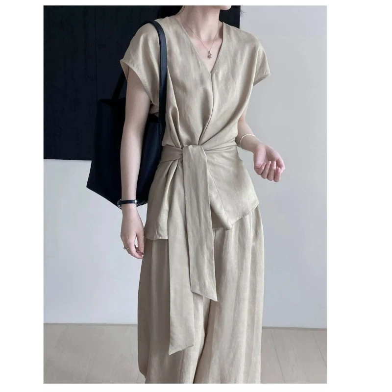 

Элитный комплект из хлопка и льна однотонного цвета: женский летний новый комплект из двух предметов — топ-жилет с V-образным вырезом и шнуровкой + свободные брюки с широкими штанинами