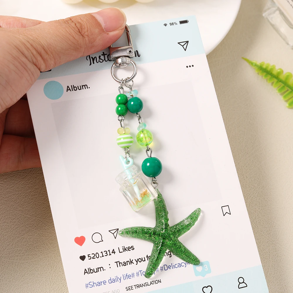 Aihua Niedlicher Y2K-Schicker Sommer-Strand-Seestern-Schlüsselanhänger für Damen und Mädchen, Handtaschenanhänger, Air Pad Hülle, Riemen, handgefertigter Schmuck, Geschenke – Detail 1
