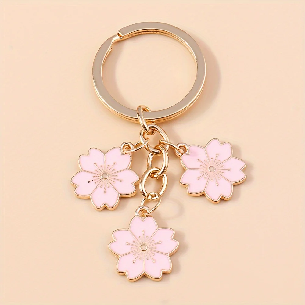 

Cherry Blossom Keychain - Simple and fashionable cherry blossom key pendant for ladies' handbags as key decorations. Features sweet girlish floral design. Available in multiple colors. Bright and vivid in color. Suitable for daily wear.