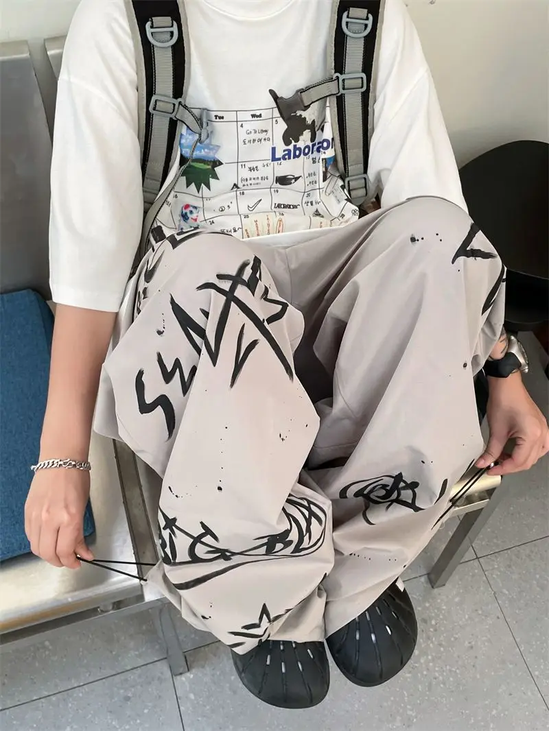 

Street hip-hop graffiti overalls women Summer American jazz street dance wide leg pants Versatile straight leg pants trend