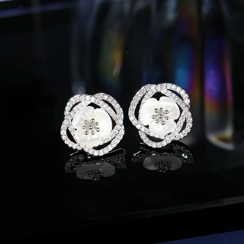 

Fashionable hollowed-out camellia natural shell flower earrings s925 silver needle niche design earrings