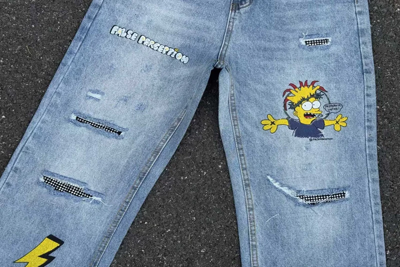 เย็บปักถักร้อยการรับรู้ปลอมเพชรการ์ตูน Graffiti กางเกงยีนส์ผู้ชายผู้หญิงคุณภาพสูง Hip Hop เสียหลวมตรงกางเกงยีนส์