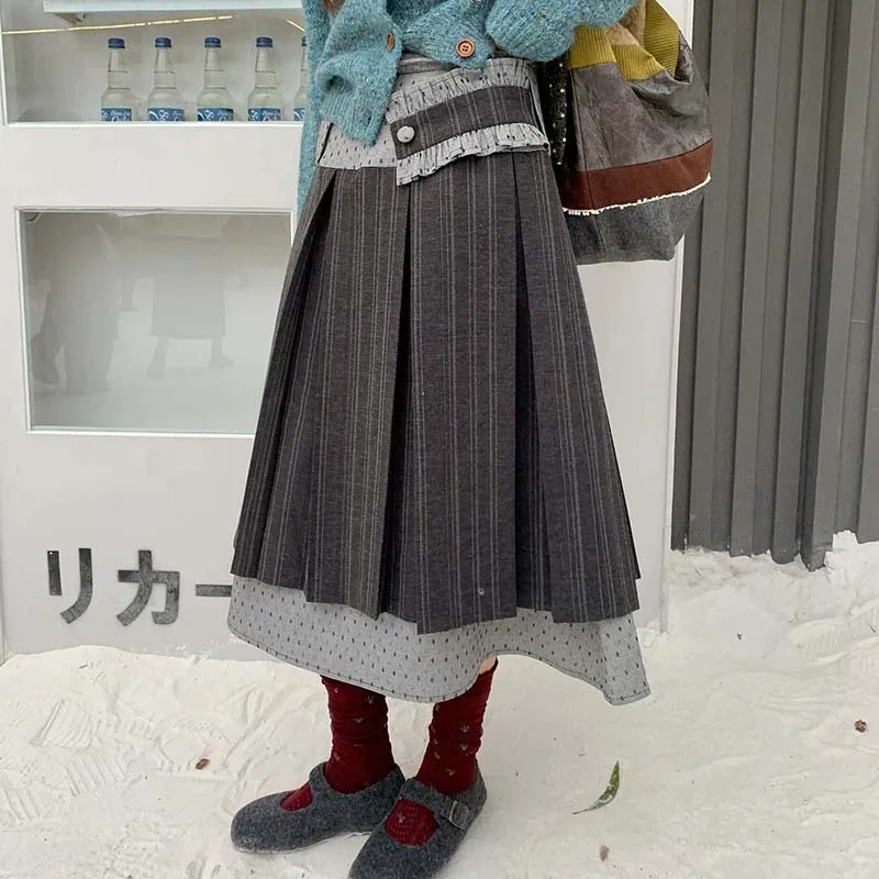 Korean design sense stitching pleated skirt female 2026 new autumn and winter new loose A-word simple long skirt