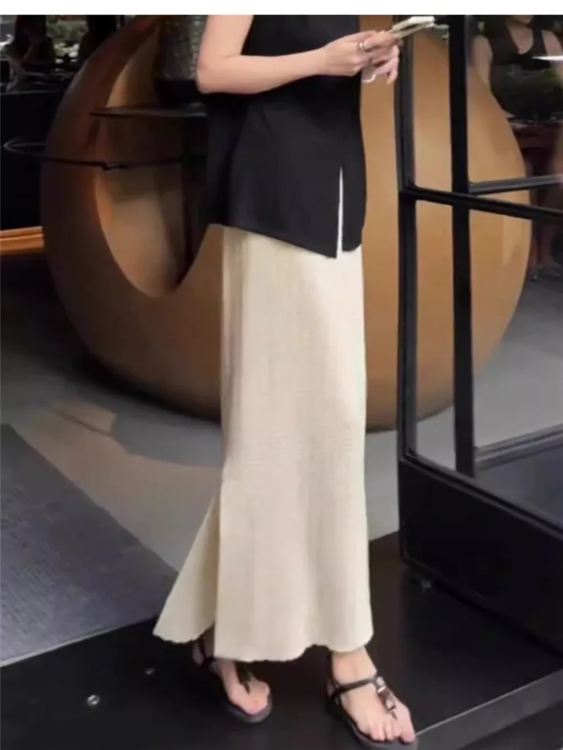 Gonna a trapezio scavata lavorata a maglia albicocca Donna 2025 Nuova primavera autunno Elastico in vita Spacco morbido Gonne temperamento versatile