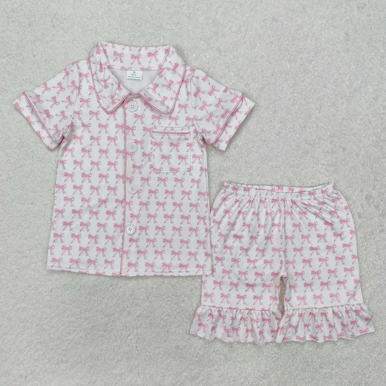 Vendita all'ingrosso neonata maniche corte camicia con tasca con bottoni indumenti da notte pantaloncini con fiocchi rosa set pigiama infantile per bambini biancheria da notte