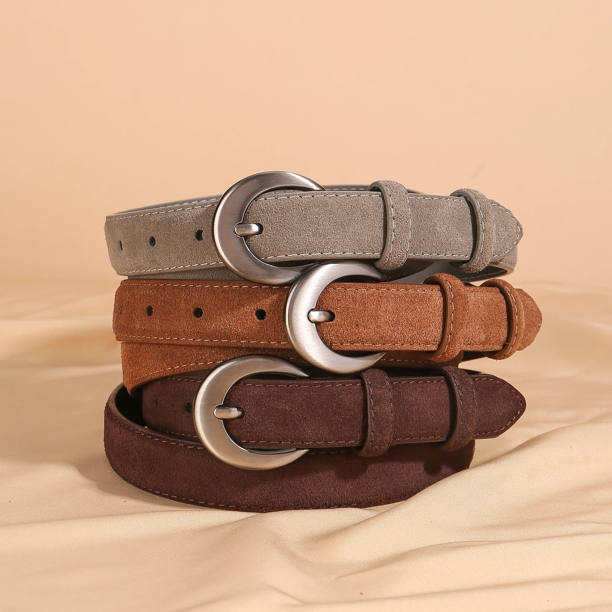 Stylish women's suede leather belt crafted from double-layer cowhide with a designer silver buckle. Available in multiple colors