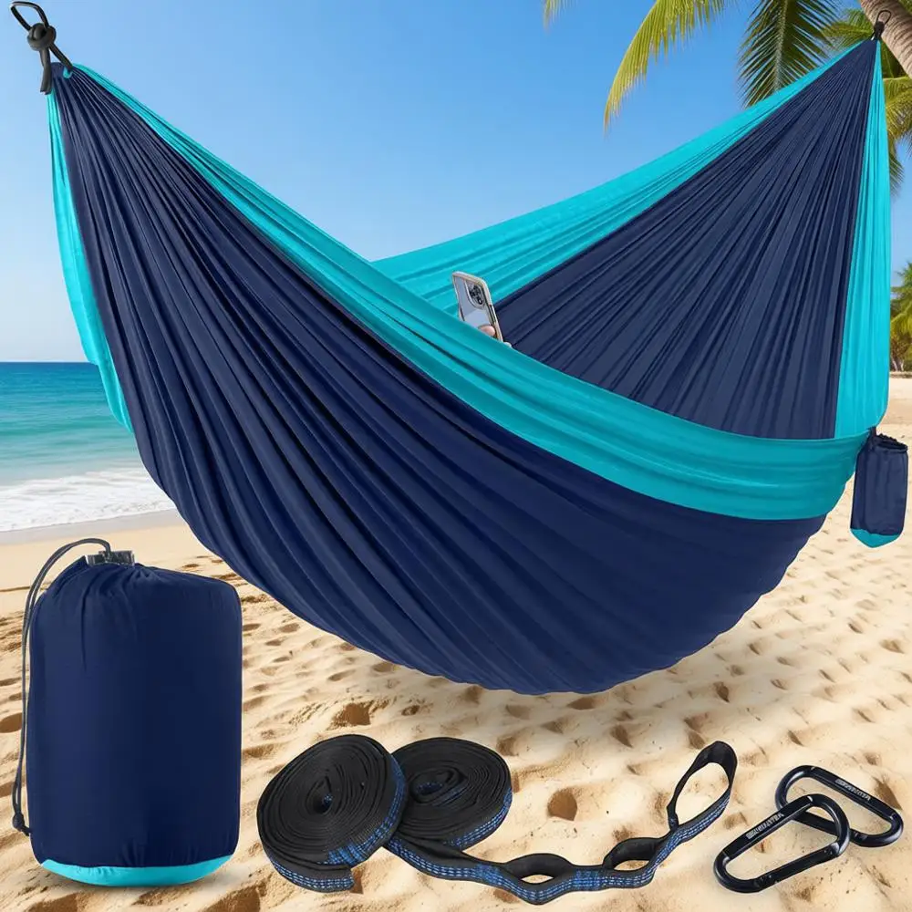 

Нейлоновый гамак для кемпинга (двойной/одинарный) с грузоподъемностью 180 кг, ремнями для крепления к деревьям и сумкой для переноски – идеально подходит для активного отдыха, путешествий, пляжа и баджинга.