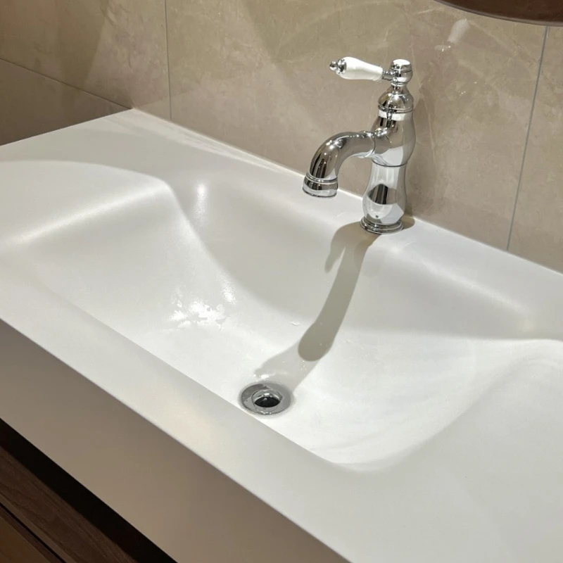 Rock slab hot bending integrated basin, bathroom cabinet combination ceramic hotel hand and face basin