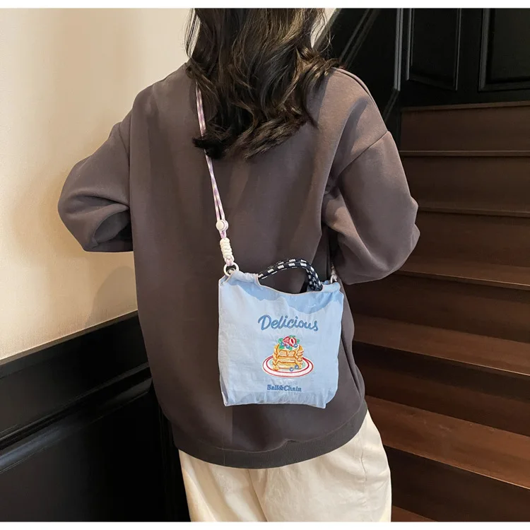 Women's Cute Apple Core Embroidery Drawstring Bag Colorful Braided Strap Mini Canvas Crossbody Bag for Daily Use