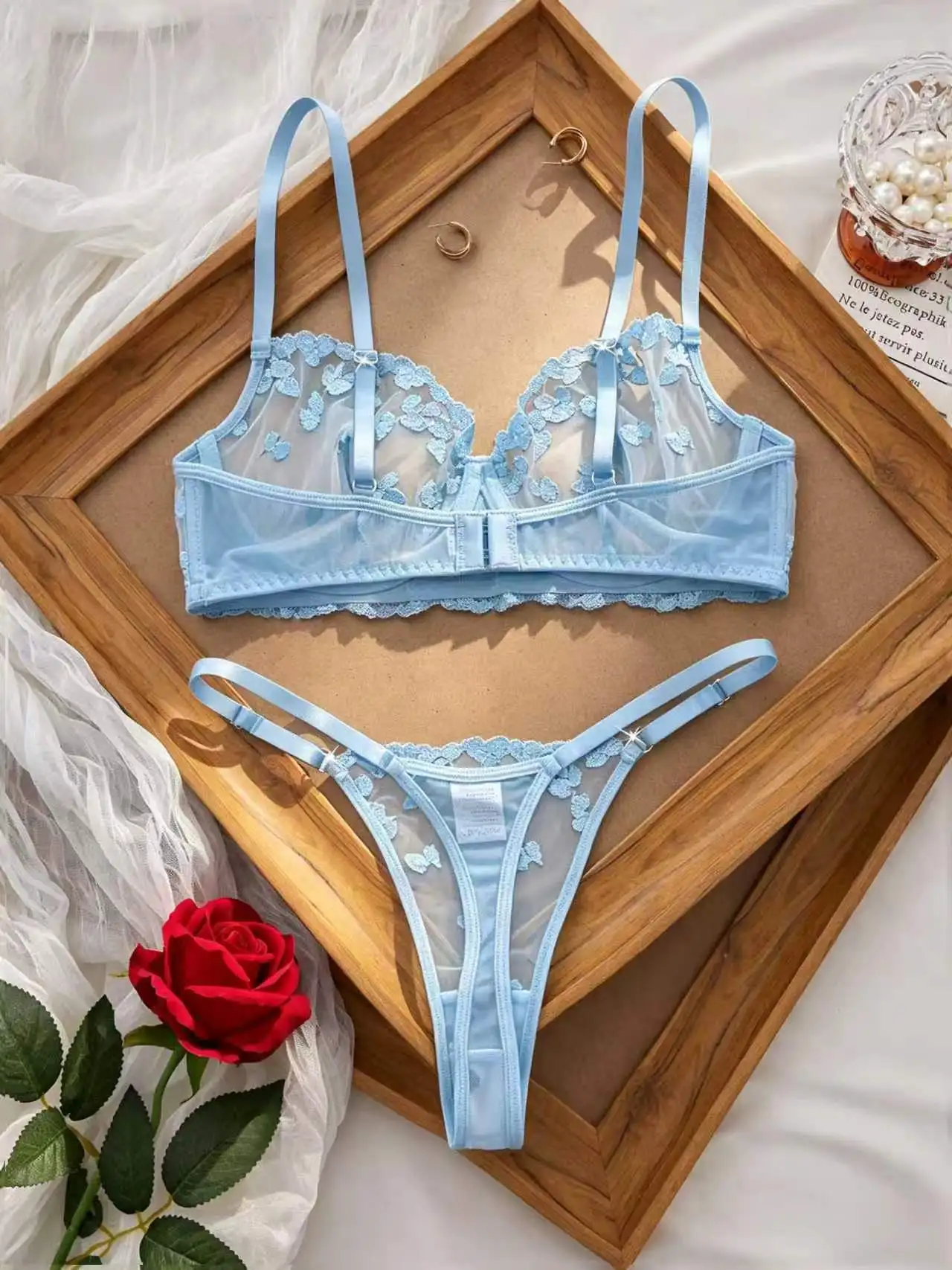 Matching thong detail with embroidered floral mesh and delicate strap design