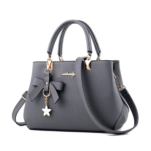 Damskie torby listonoszki z kwiatowym wisiorkiem, modne torebki damskie do biura, czyste torebki damskie, nowe torby na ramię crossbody.