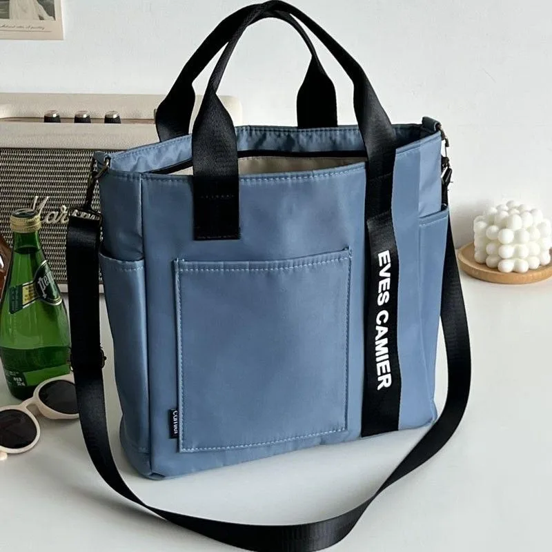 Nuevo bolso de mano informal de gran capacidad, bolso de lona impermeable de nailon, bolsos de mensajero simples de moda para colegiala