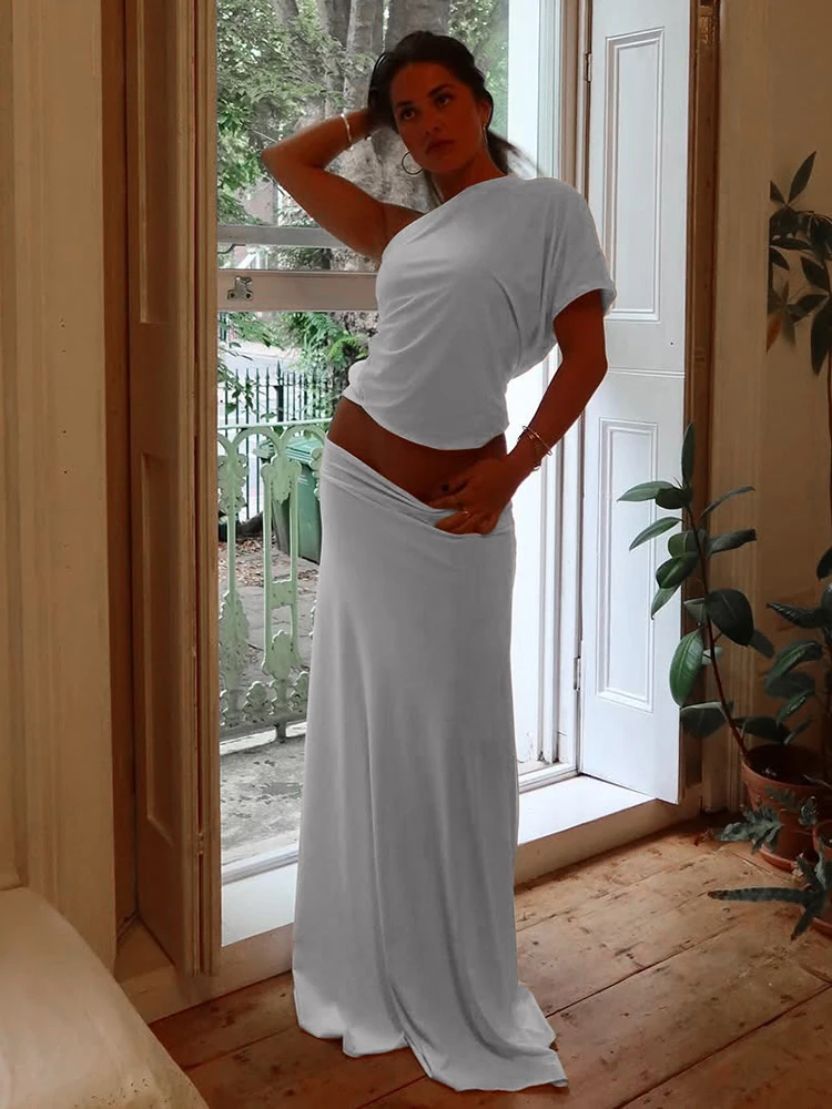 

Элегантный комплект Kliou из 2 предметов: топ с асимметричным воротником, одним рукавом и открытой спиной + длинная юбка А-силуэта с эластичным поясом. Модный костюм.