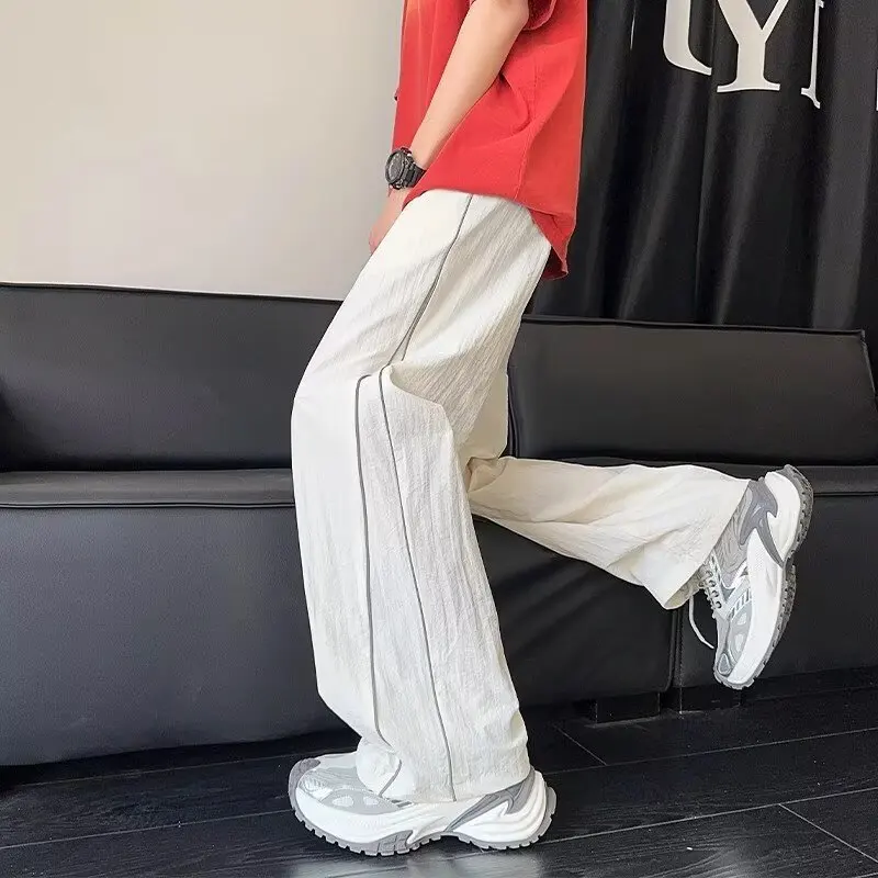 Été mince ample droit pantalons décontractés hommes jeunesse étudiant américain décontracté conception réfléchissante à la mode Sport pantalons longs